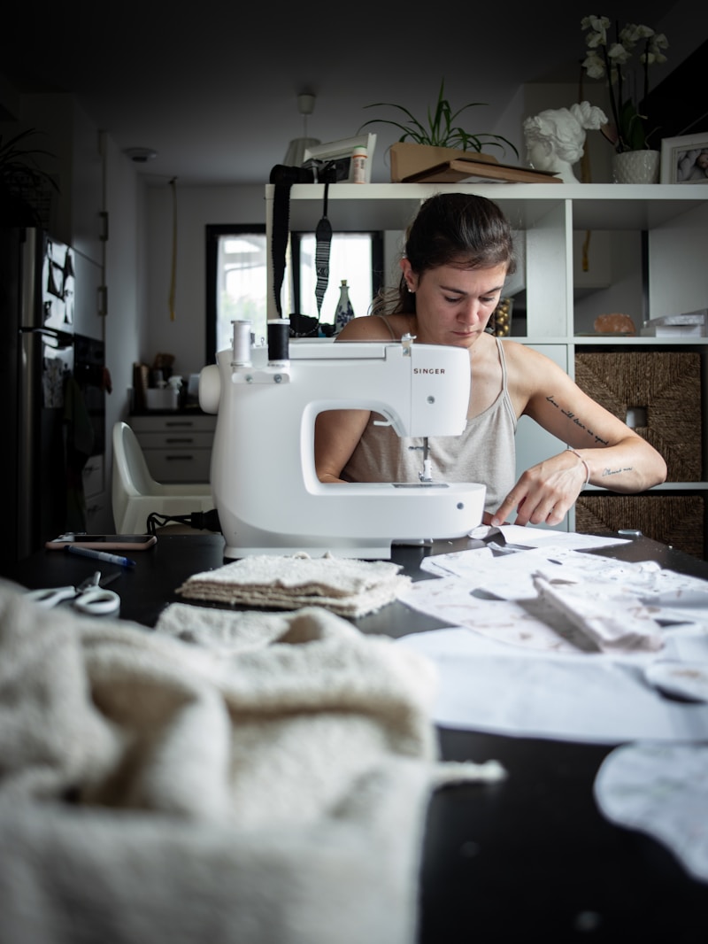 Atelier worker sewing a garment
