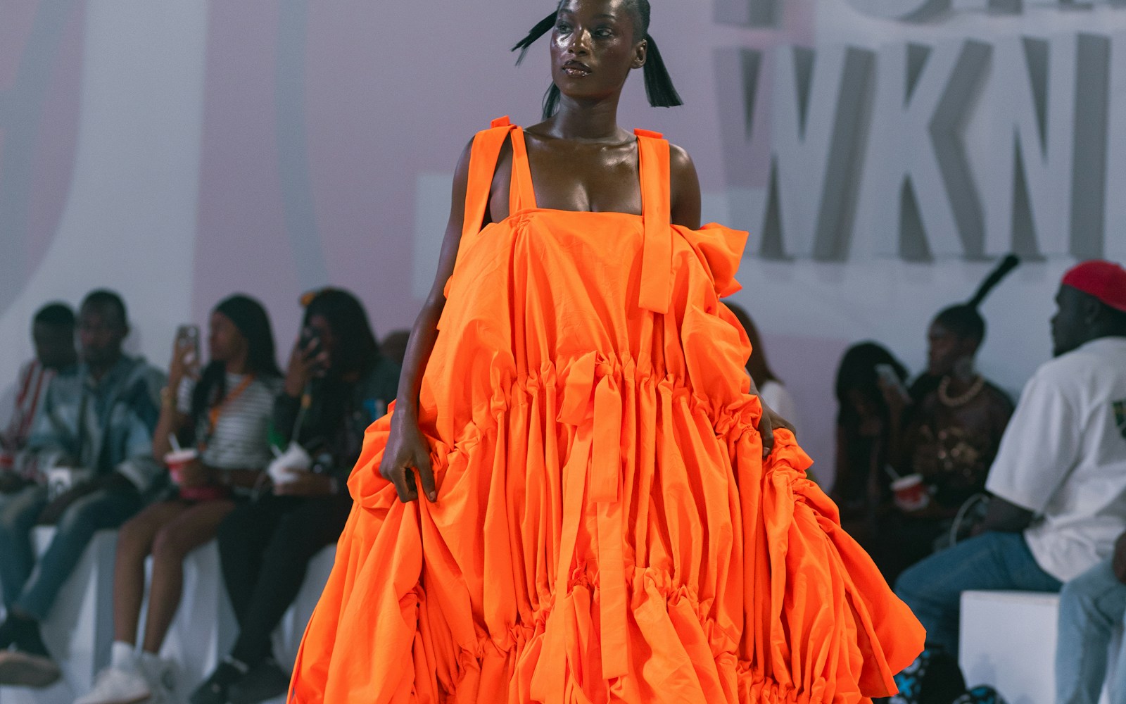 Fashion runway — woman in an orange dress